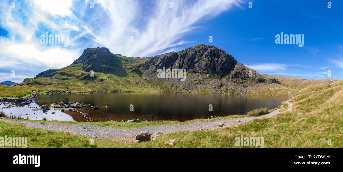 Stickle Tarn nestling under Pavey Ark fell in the Langdales. Stock Photo