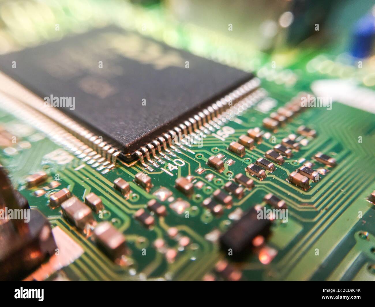 The electronic circuit board with electronic components such as chips close up. Stock Photo