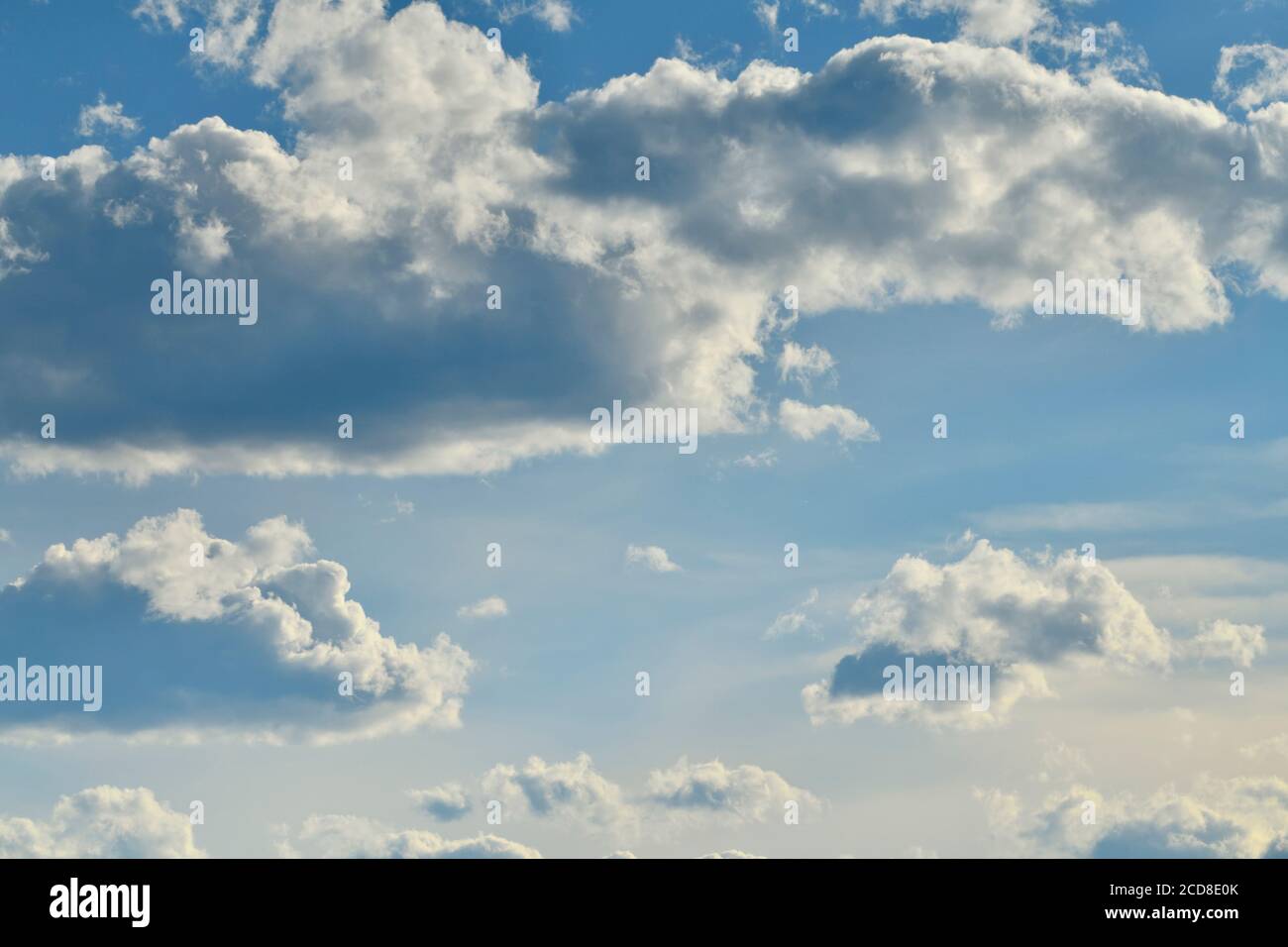 A horizontal image og a blue sky with white clouds in rural Alberta Canada Stock Photo