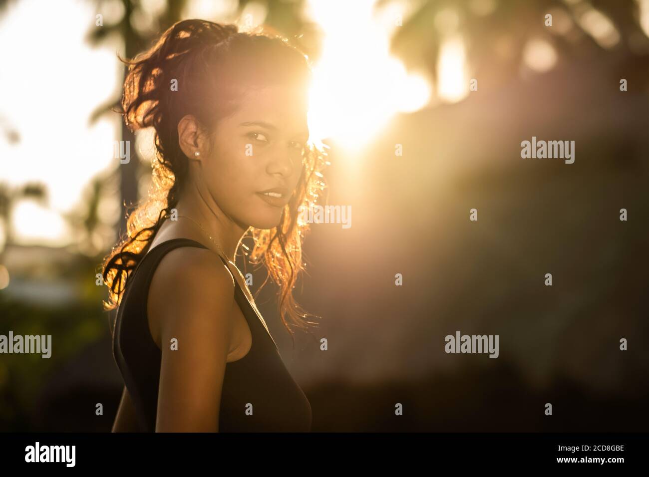 Beautiful latina sunset portrait - Young Venezuelan woman looking at camera Stock Photo