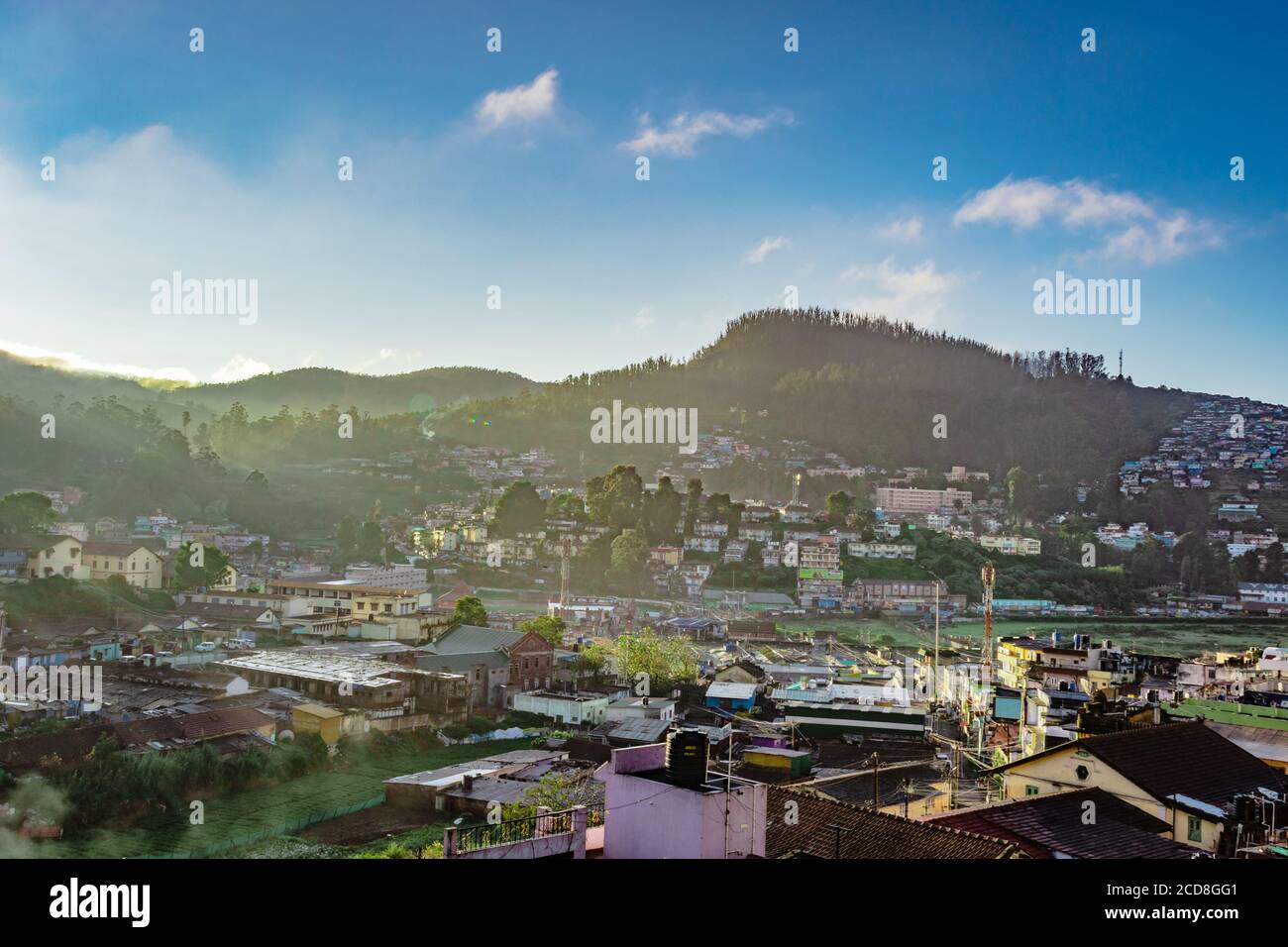 city view with mountain and bright blue sky from hill top at dawn image is taken from doddabetta peak ooty india. it is showing the bird eye view of o Stock Photo