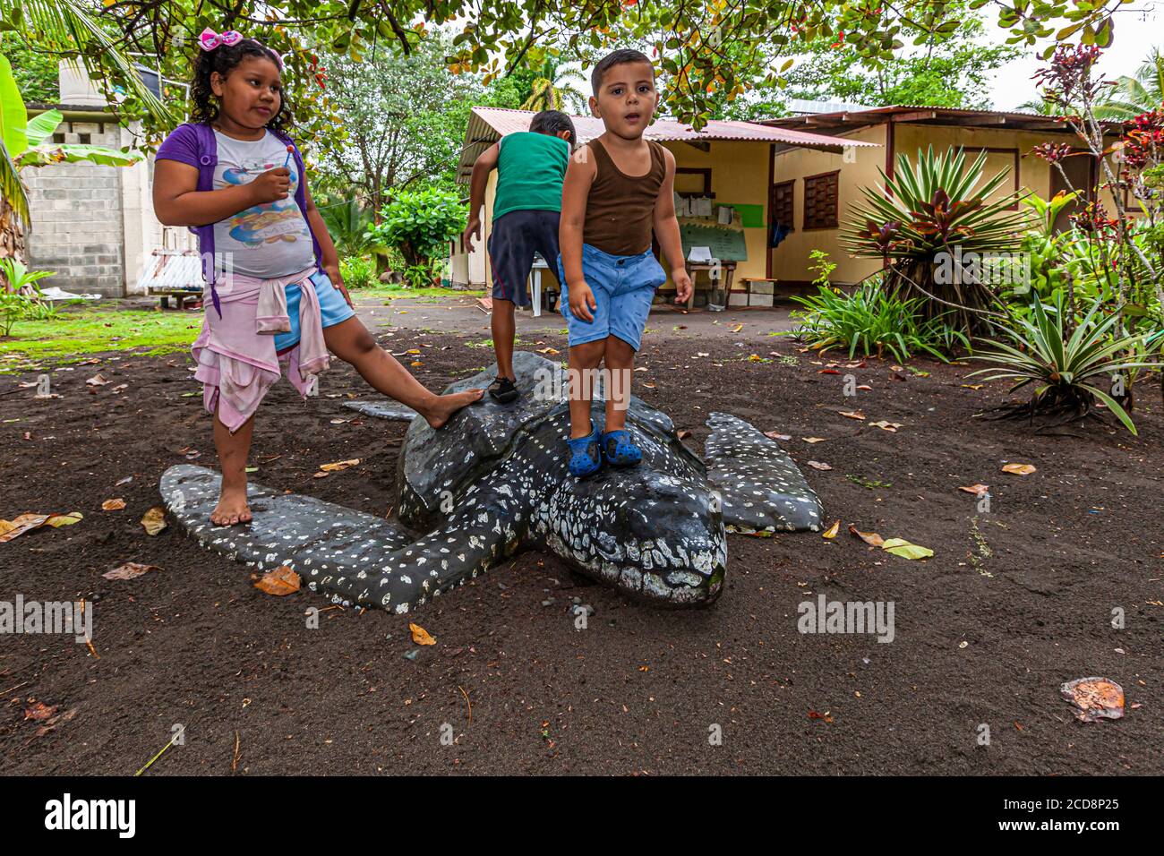 Local Children playing at the Biosphere Citizen Scientist Project Camp to save Sea Turtles in Reventazón, Costa Rica Stock Photo