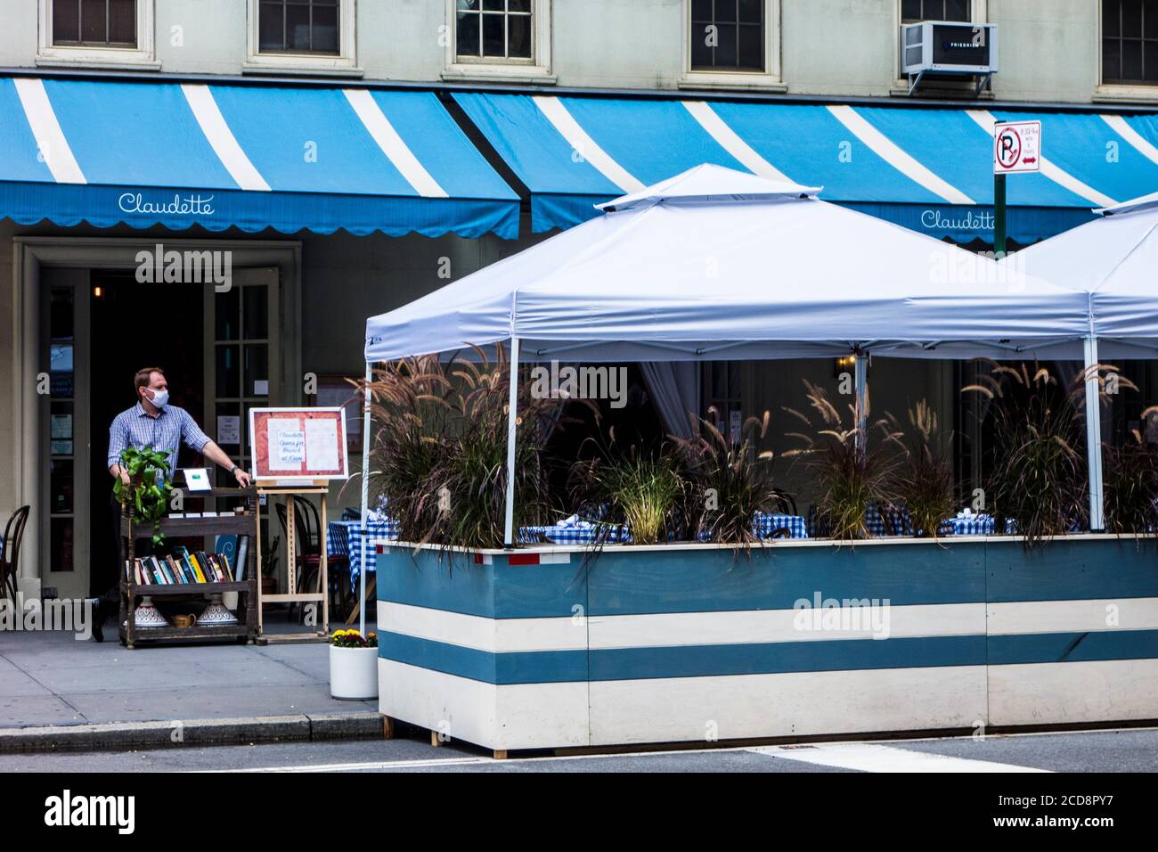 Outdoor seating during the Covid 19 pandemic at Claudette Restaurant on Fifth Avenue in Greenwich Village, New York City, NY, USA Stock Photo
