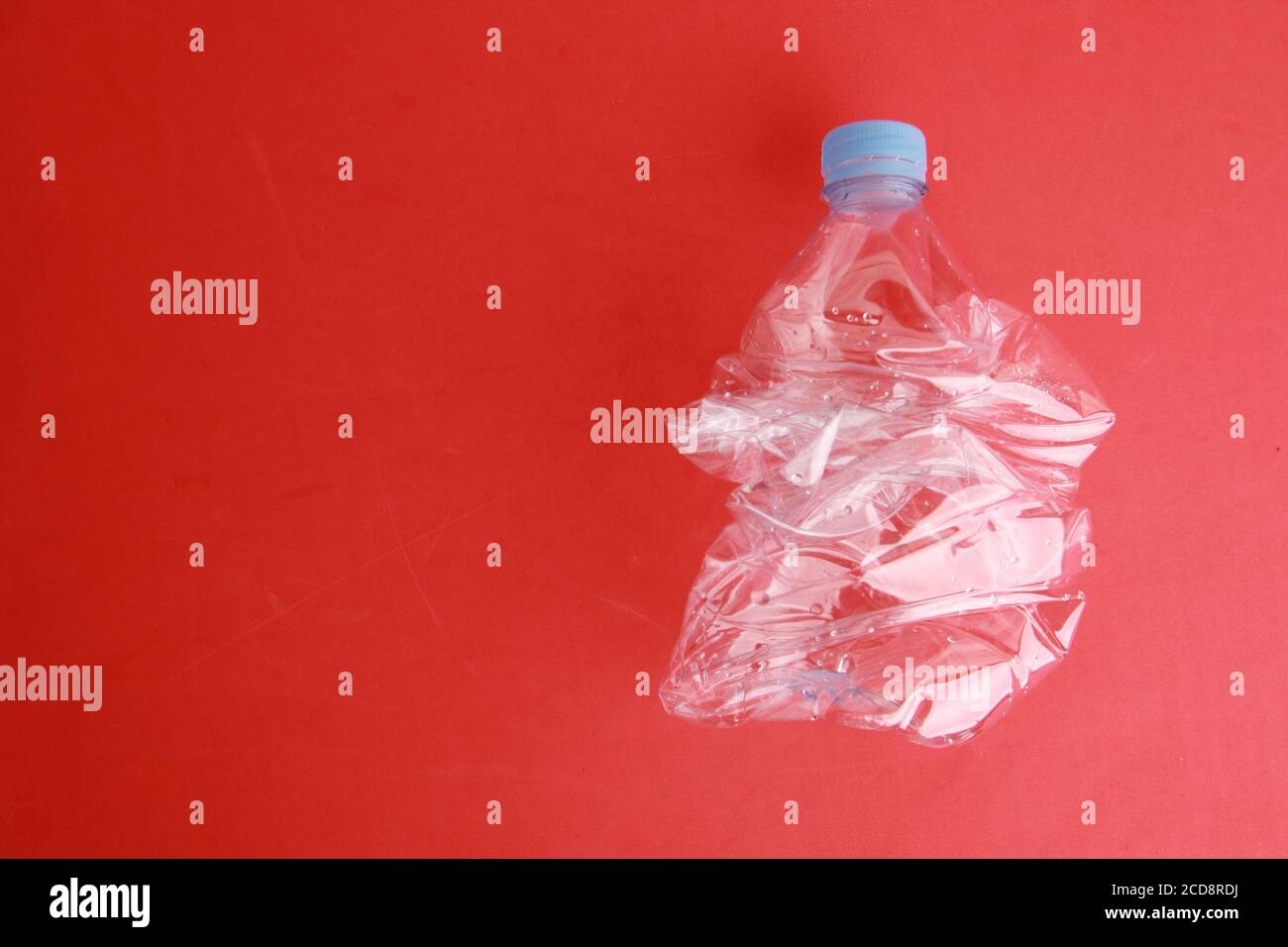 Empty plastic water bottle scaled for recycling Stock Photo