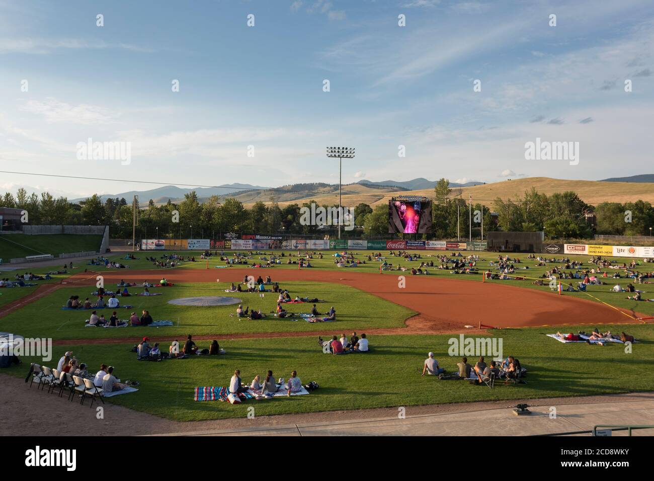 Visitors are carefully spaced while viewing the film “Space Jam” at