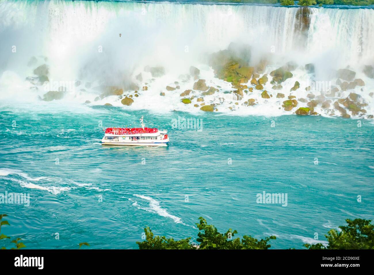 Tour boat navigating the lake at Niagara Falls, Canadian side of the ...