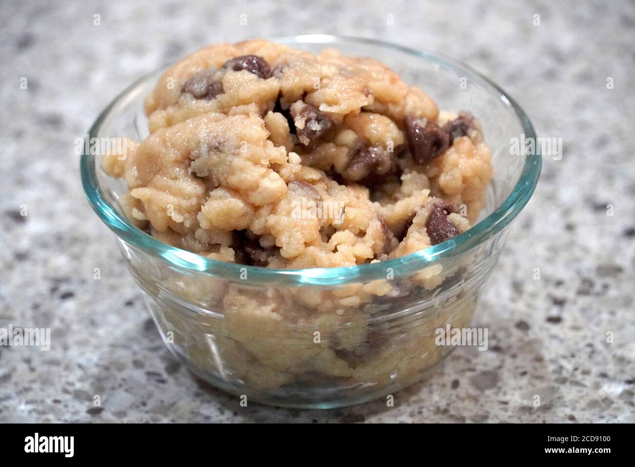 Edible chocolate chip cookie doughs scoop in a glass bowl Stock Photo