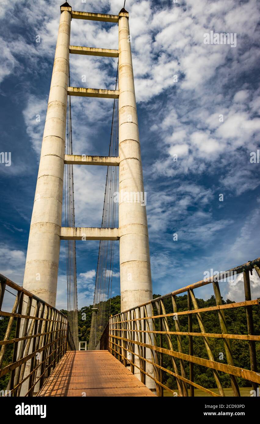 suspension iron cable bridge isolated with bright blue sky from unique different angle image is taken at honnavar karnataka india. it is the fine exam Stock Photo