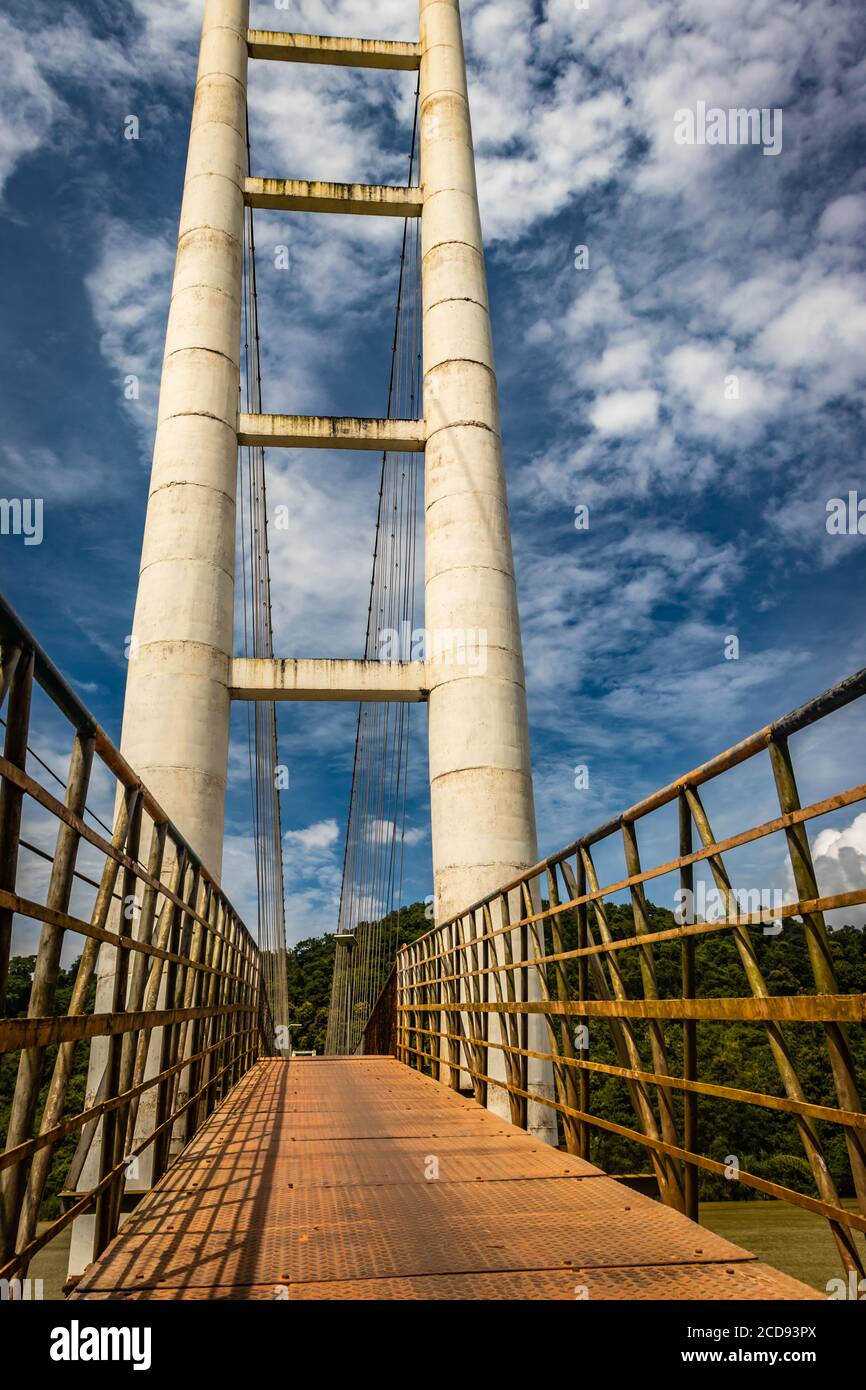 suspension iron cable bridge isolated with bright blue sky from unique different angle image is taken at honnavar karnataka india. it is the fine exam Stock Photo