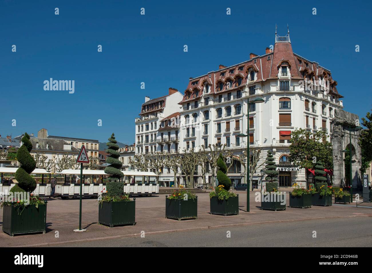 France, Savoie, Aix les Bains, Riviera of the Alps, trees sizes in topiary art and small tourist train on the place of the baths and the old hotel Astoria Stock Photo