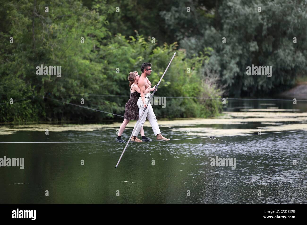 France, Indre et Loire, Cher valley, Jour de Cher, dam of Nitray, Athee sur Cher, tightrope walker, popular event imagined by the Blere - Val de Cher community of communes to highlight the Cher valley and its river heritage Stock Photo