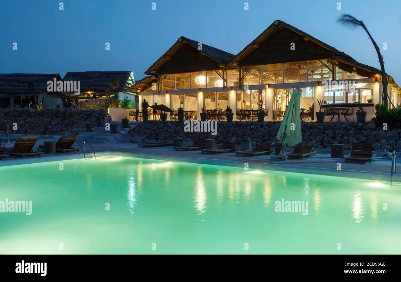 Marocco, Oued Ed-Dahab, Dakhla, La Crique Hotel, view of the pool of an eco-lodge at dusk Stock Photo