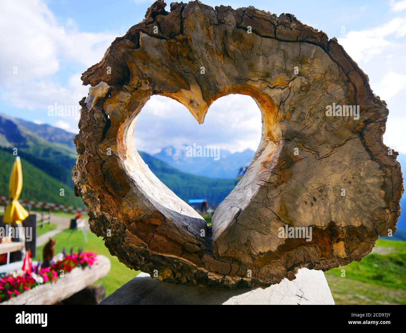 Visp, Switzerland: The Dom mountain (4545 m) through a wooden heart Stock Photo