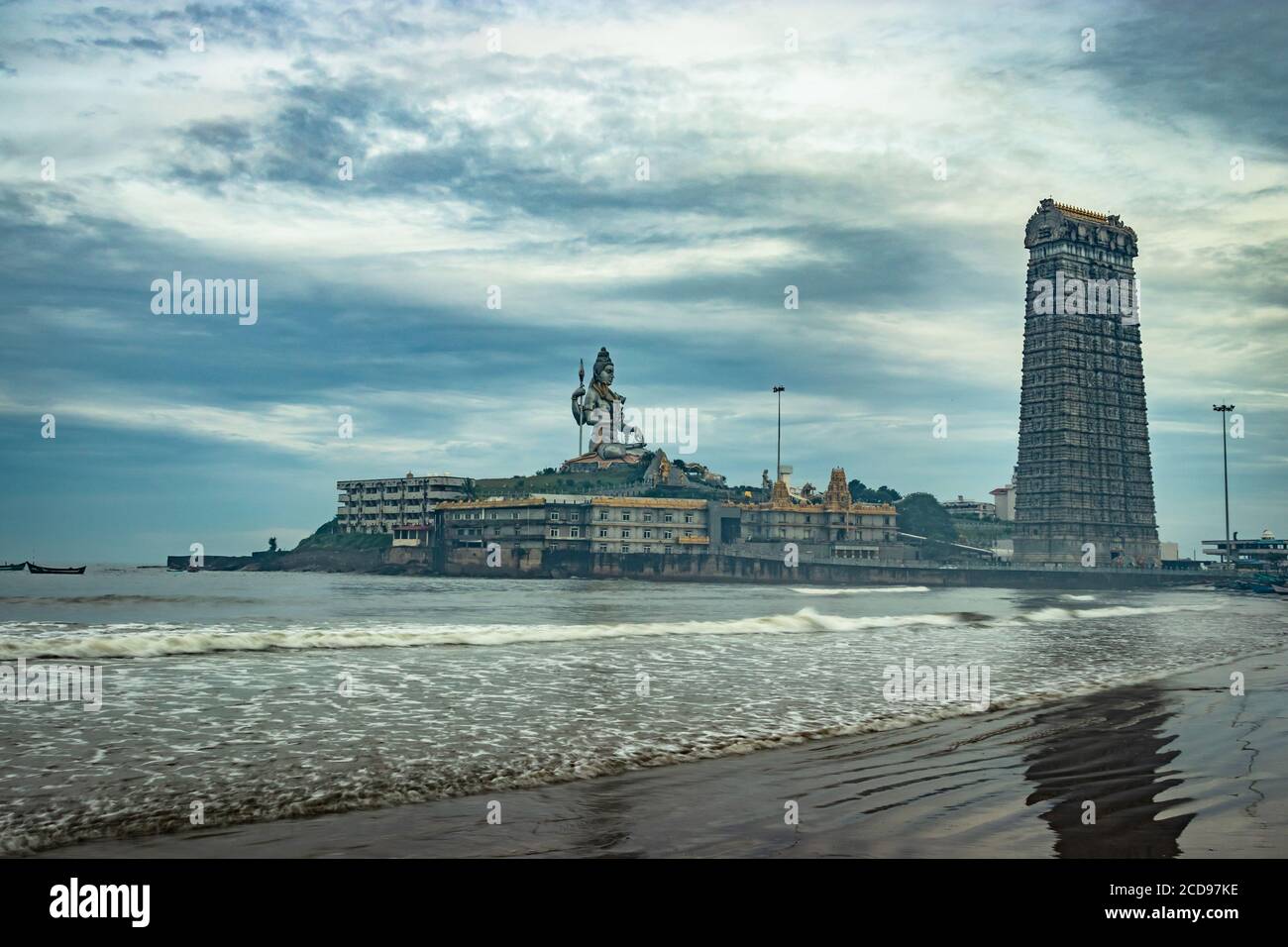 murdeshwar temple early morning view from low angle with sea waves image is taken at murudeshwar karnataka india at early morning. it is the house of Stock Photo