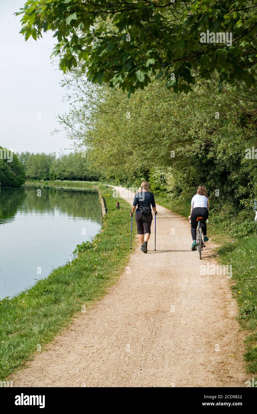 Women social distancing on towpath beside river Cam near Milton May 2020 Stock Photo