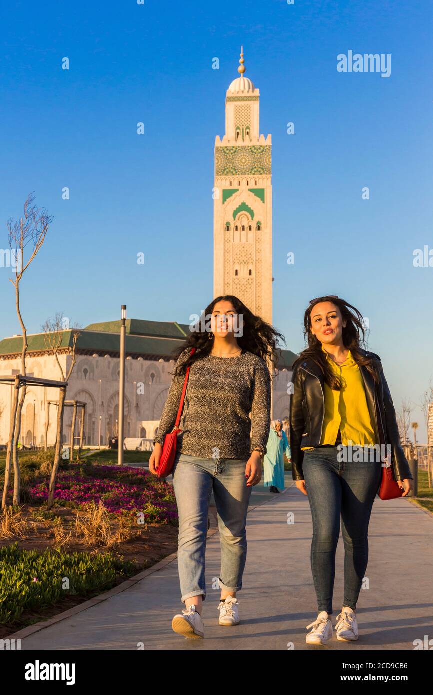 Morocco, Casablanca, young women on the forecourt of the Hassan II mosque Stock Photo