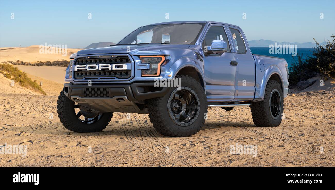 Ford F-150 Raptor - Most Extreme Production Truck On The Planet standing on a sand dune by the ocean Stock Photo