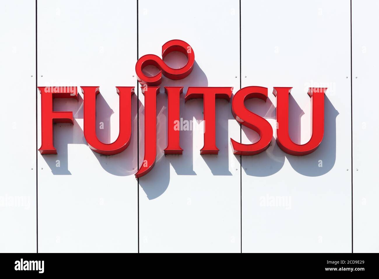 Aarhus, Denmark - August 22, 2015: Fujitsu logo on a wall. Fujitsu is a Japanese multinational information technology equipment and services company Stock Photo