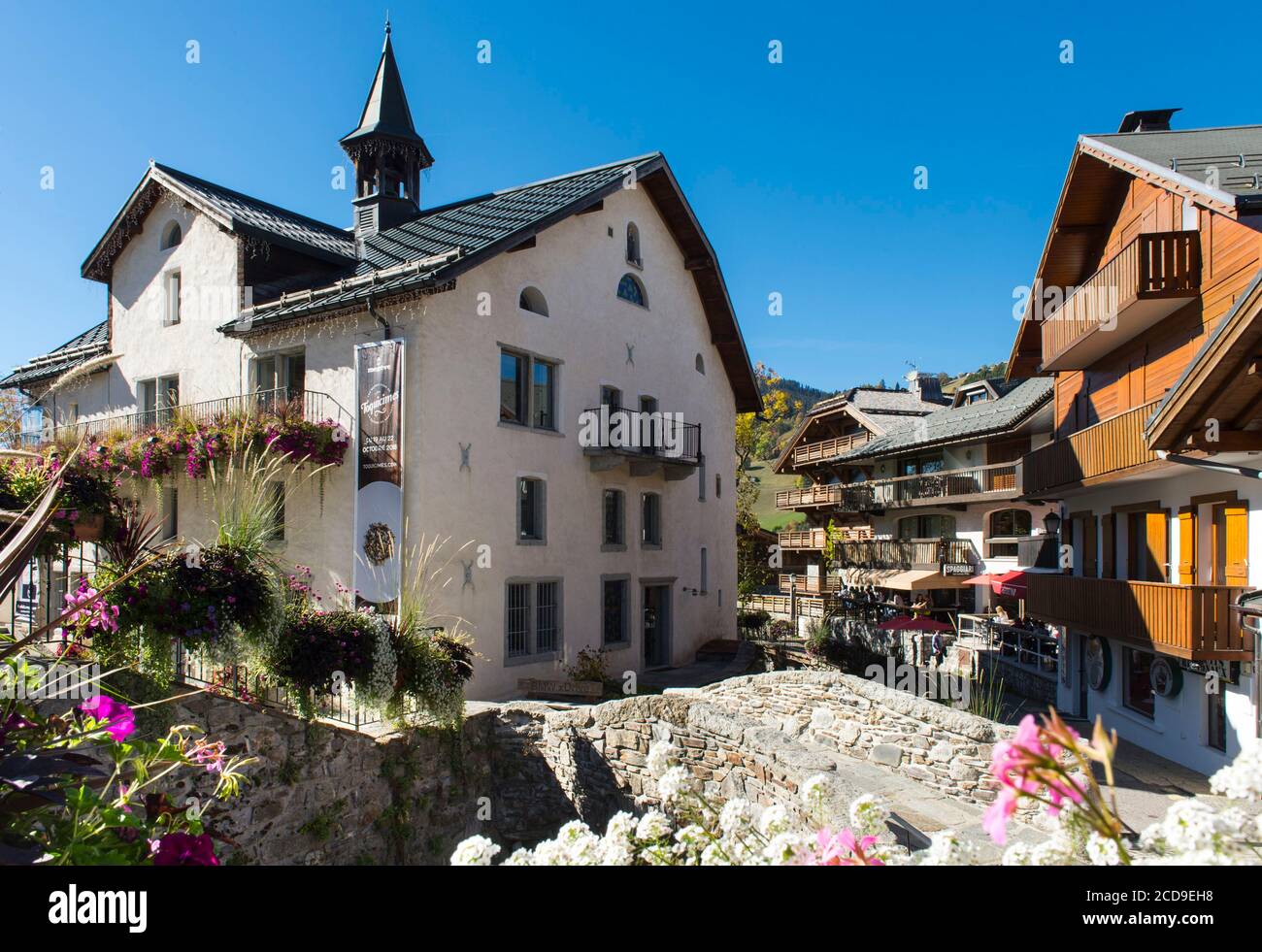 France, Haute Savoie, Megeve, the building of the tourist office and the bridge over the torrent Glapet Stock Photo