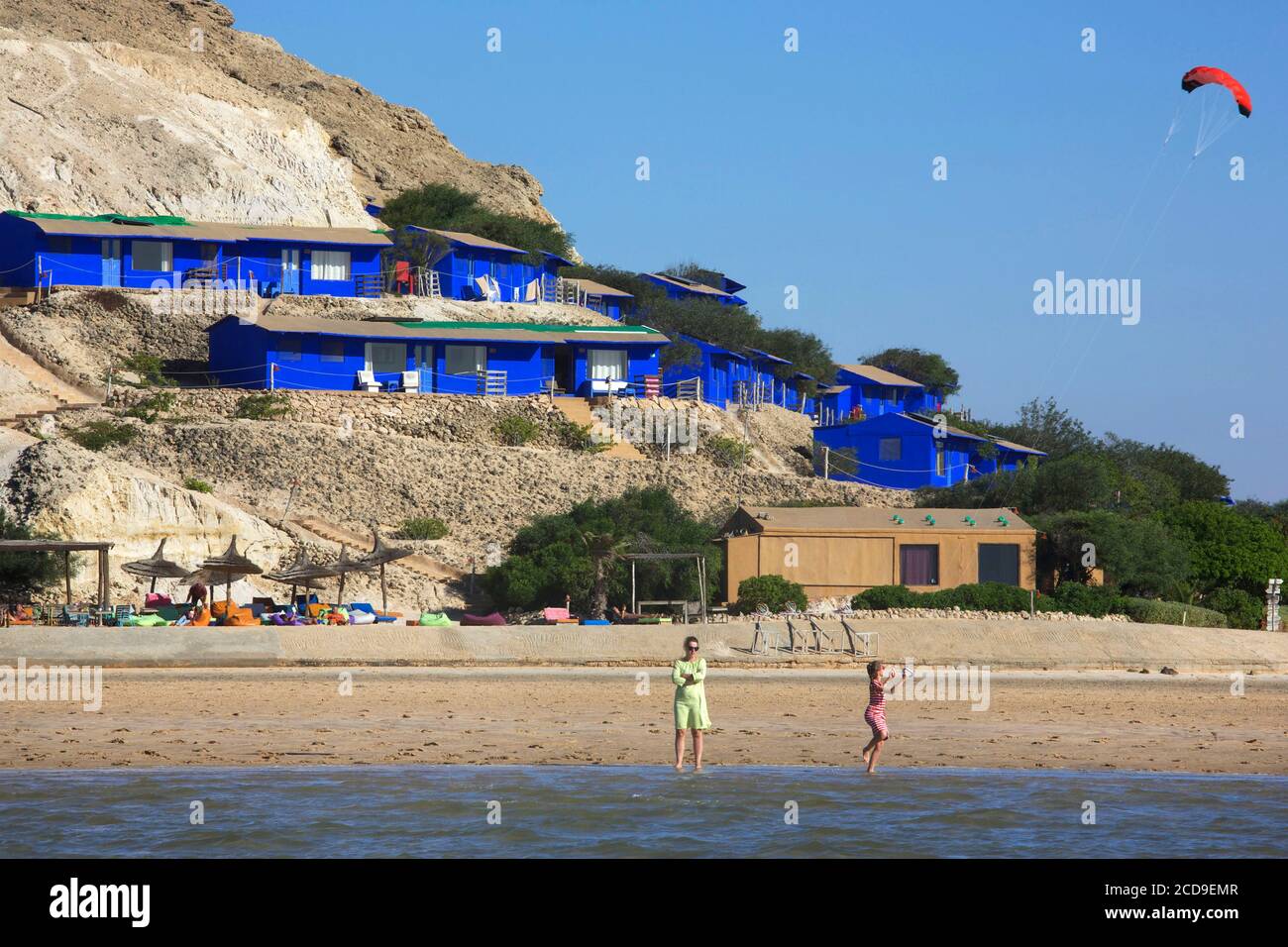 Morocco, Western Sahara, Dakhla, Dakhla kite camp Attitude posed in front of the lagoon with its Majorelle blue bungalows on the hillside Stock Photo