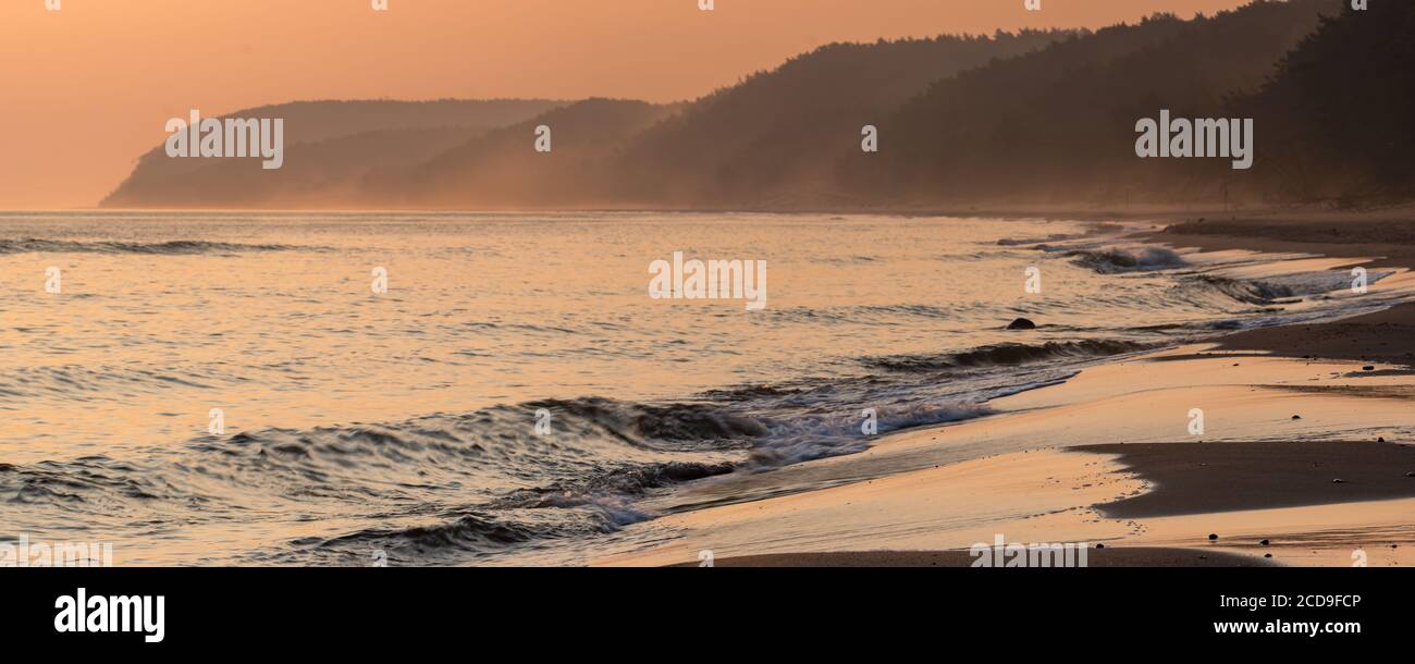 Misty morning on the sea beach Stock Photo
