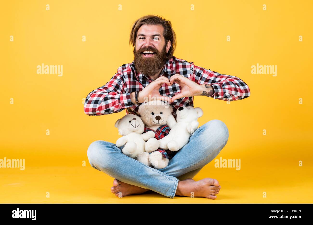my heart is yours. Man with beard hold cute toy bear. Man holds teddy bear. Gifts and holidays concept. This is for you. hipster like animal toy. Birthday holiday party celebration. feel happiness. Stock Photo