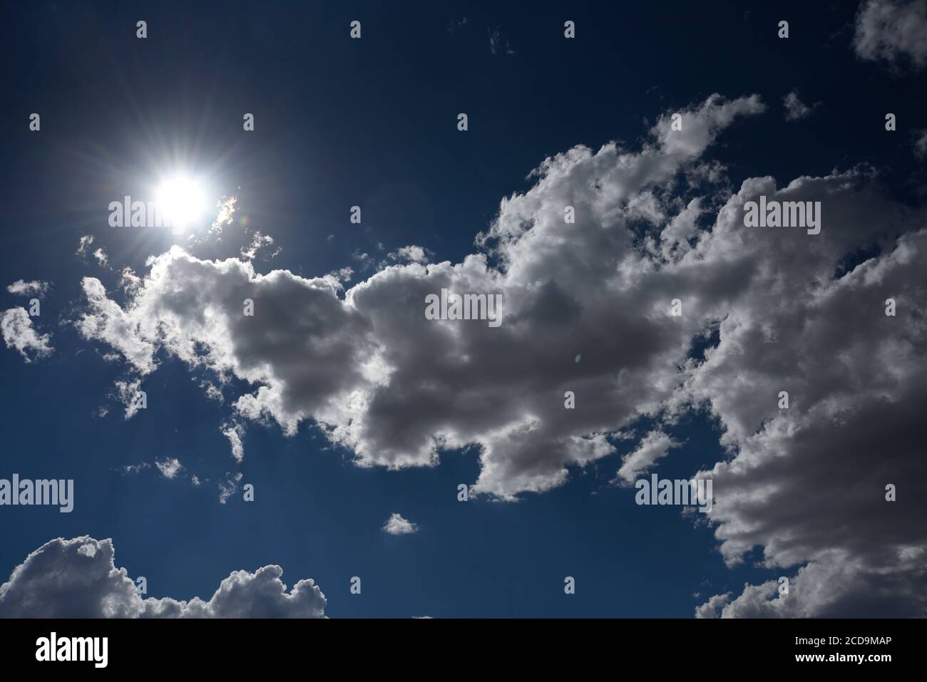 Cumulus clouds, dark with moisture, bring much needed rain showers to