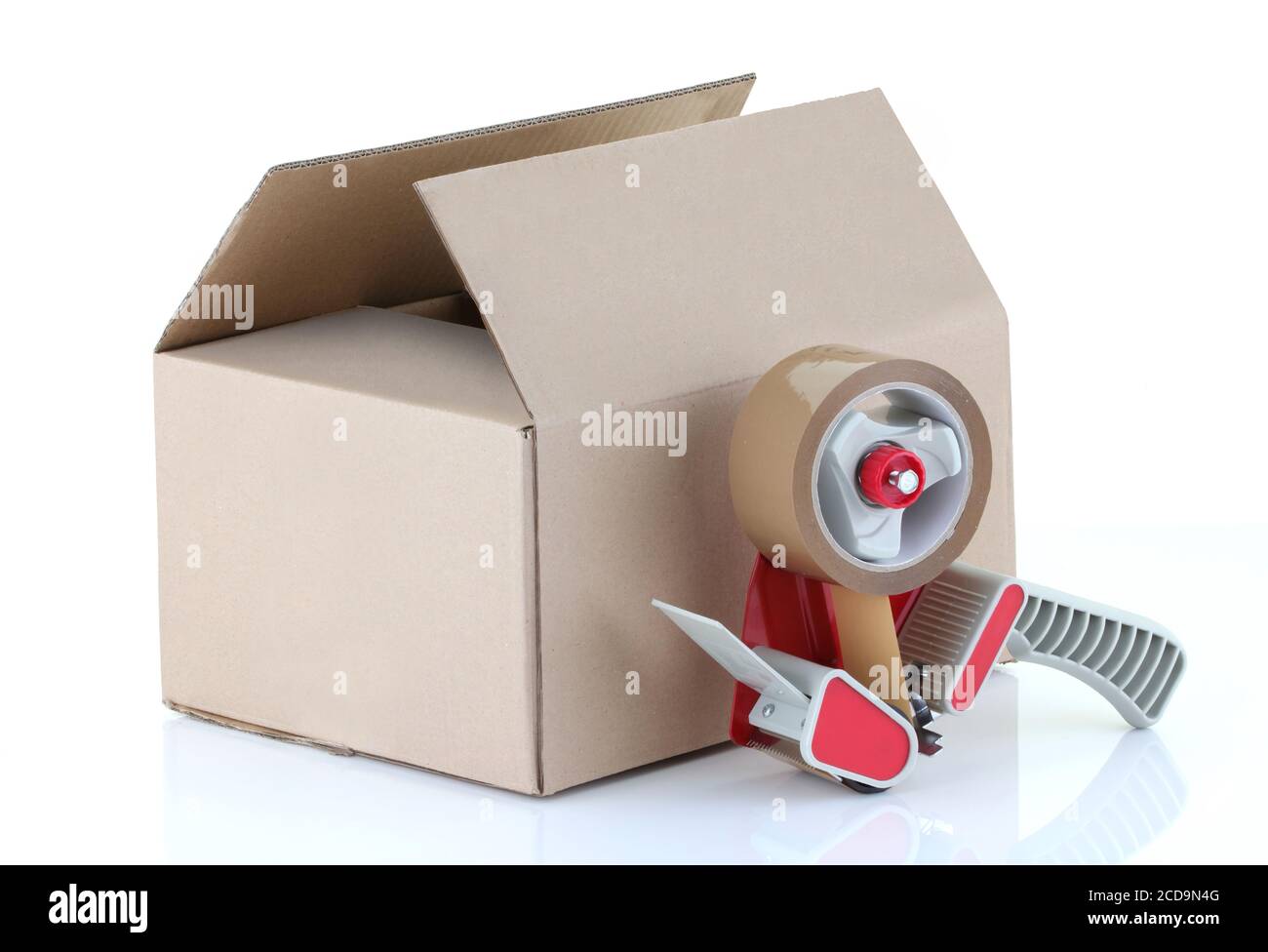 Cardboard box and packing tape gun on white Stock Photo Alamy