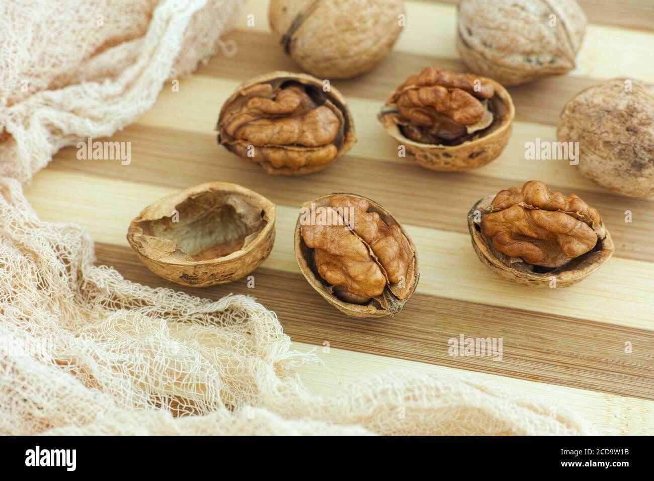 Organic walnuts on a wooden table. Close up. Stock Photo