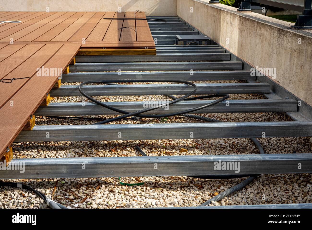 Construction of a wooden terrace on a balcony. A new wooden, timber
