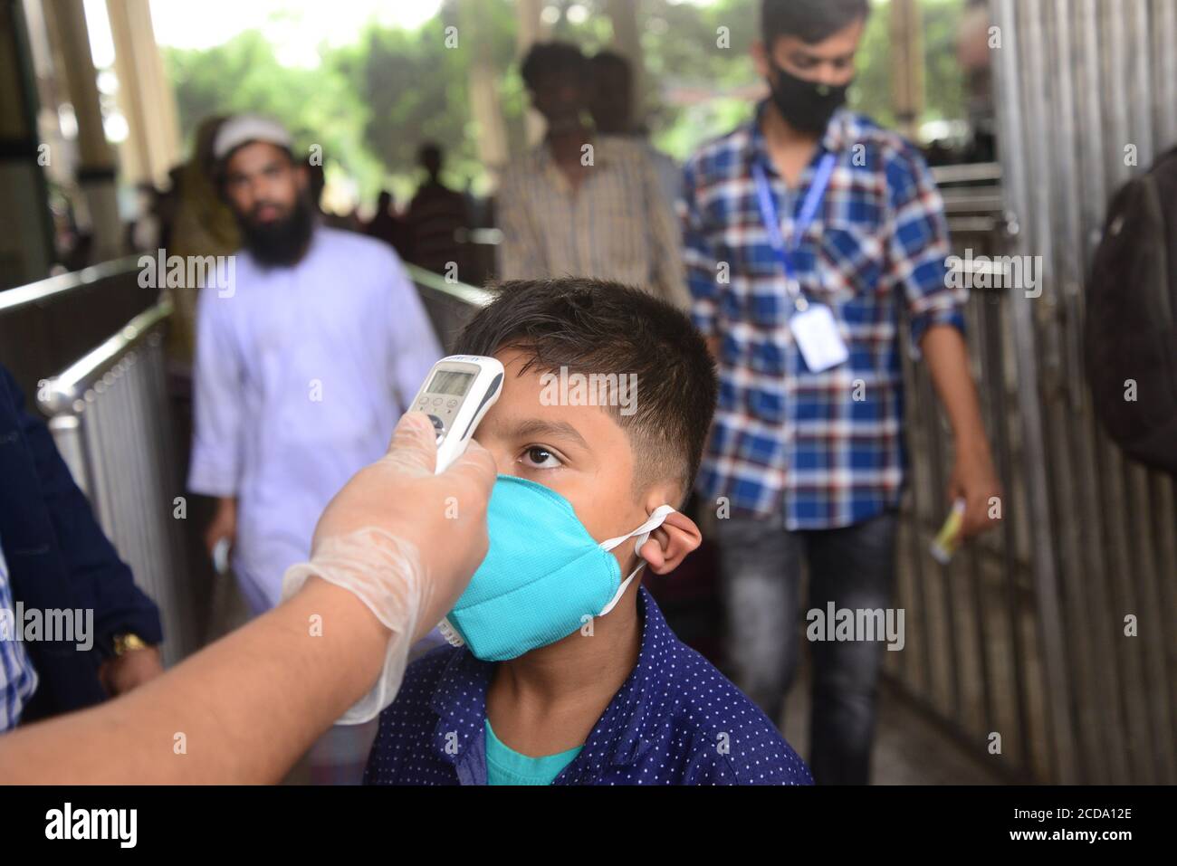 Bangladeshi Railway staff official Thermal screening of passengers is being conducted in the wake of deadly coronavirus, at a Railway Station in Dhaka Stock Photo