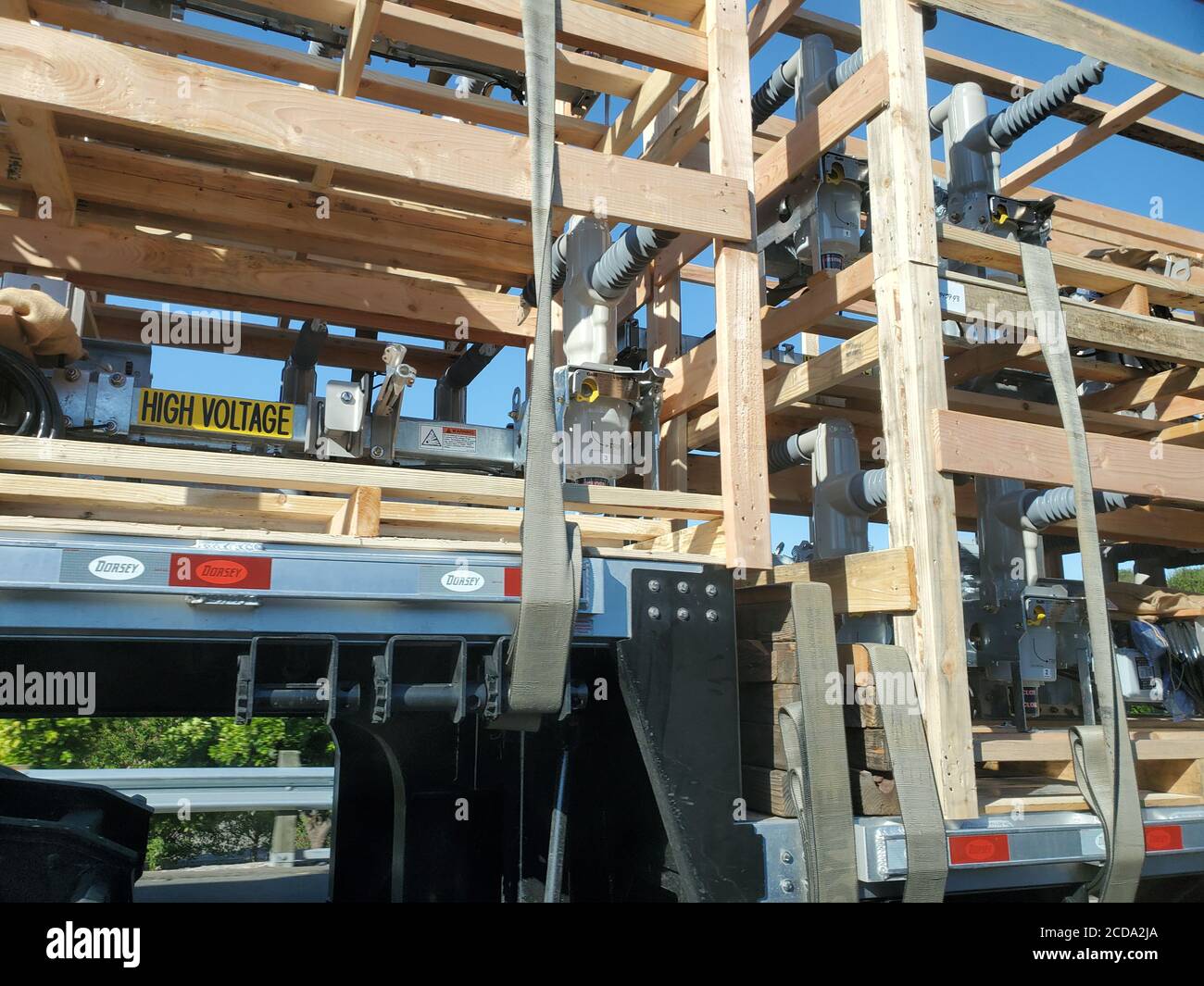 Closeup of open wooden crates containing power grid electrical