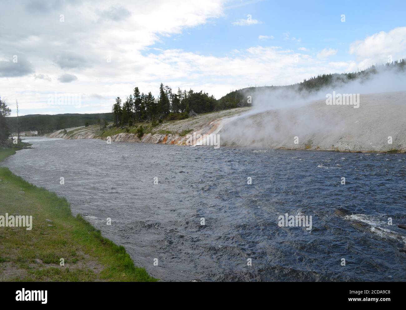 Late Spring in Yellowstone National Park: Firehole River Flows Through Midway Geyser Basin Along the Grand Loop Road Stock Photo