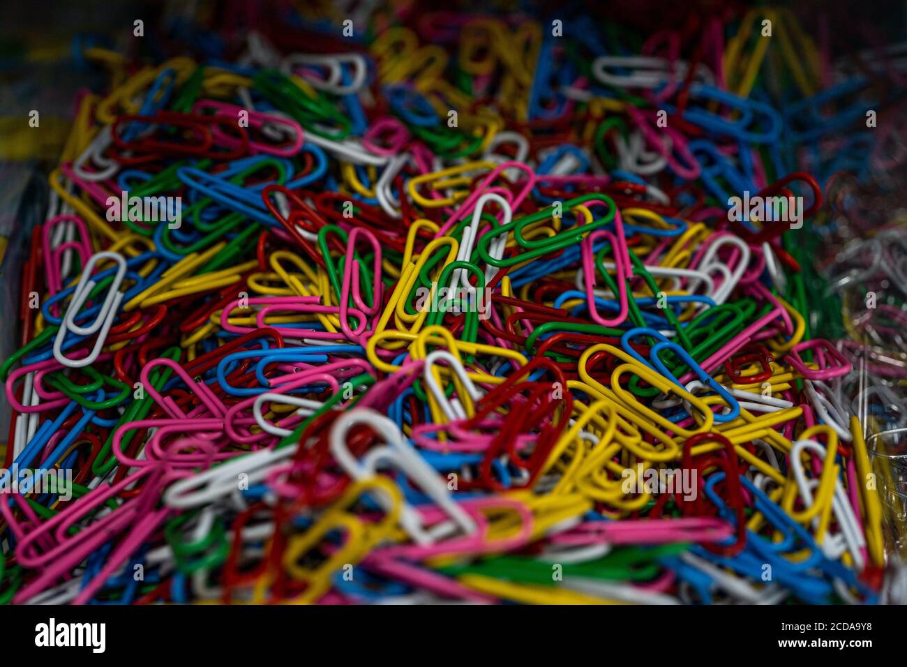 Colorful paper clips background. Macro close-up. Selected focus Stock Photo