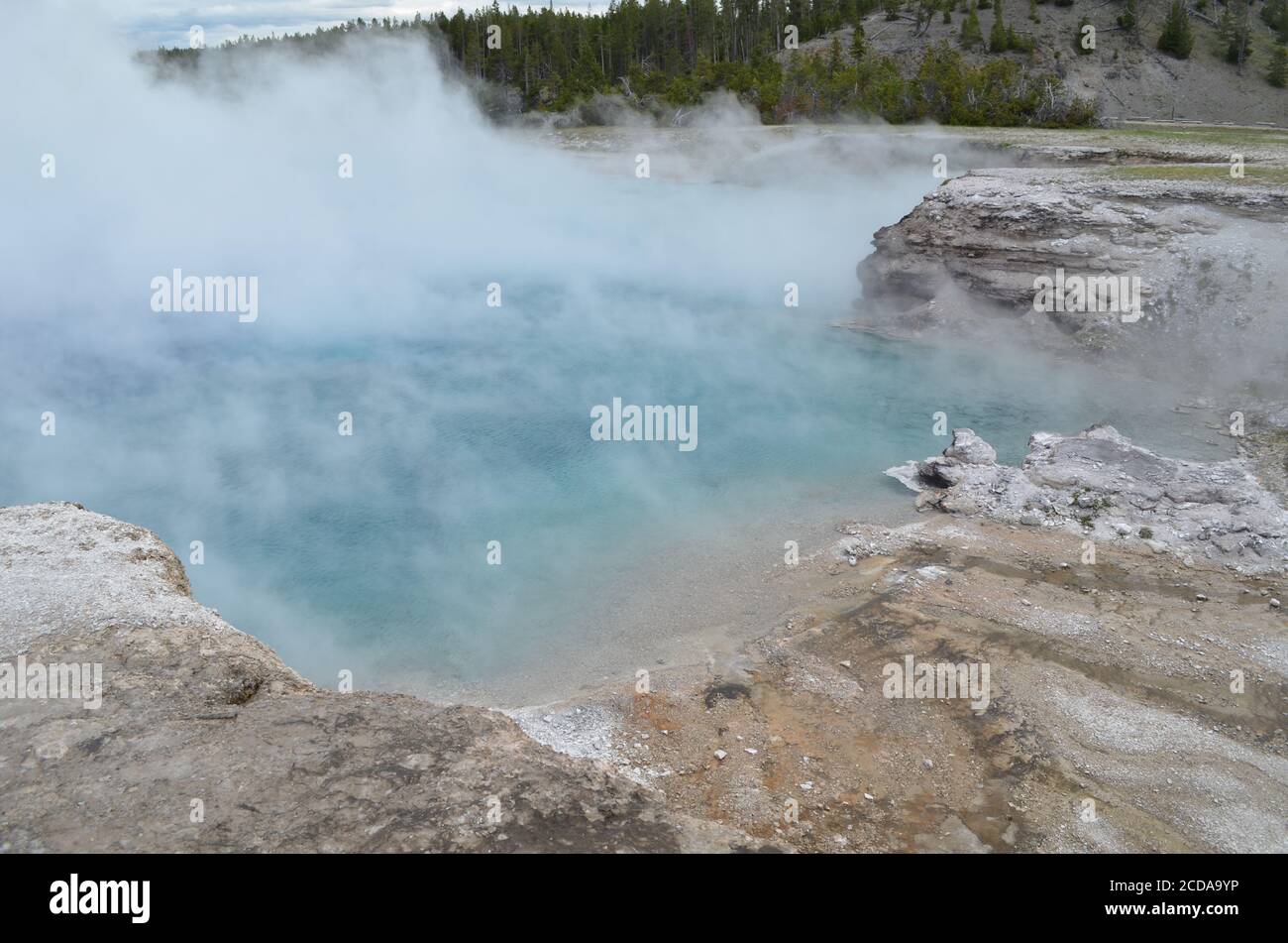 Late Spring in Yellowstone National Park: End of Excelsior Geyser Pool As Dense Steam Rolls Off in Midway Geyser Basin Stock Photo