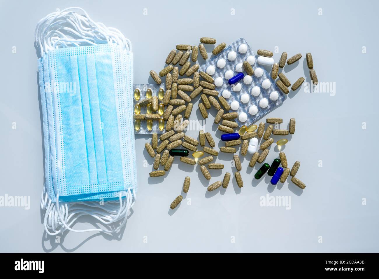 Mask Tablet A table with several surgical masks. Assorted pharmaceutical medicine ...