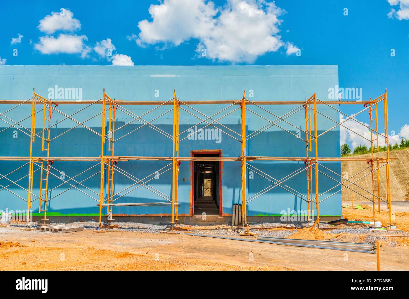 Horizontal shot of a commercial construction project with scaffolding. Stock Photo