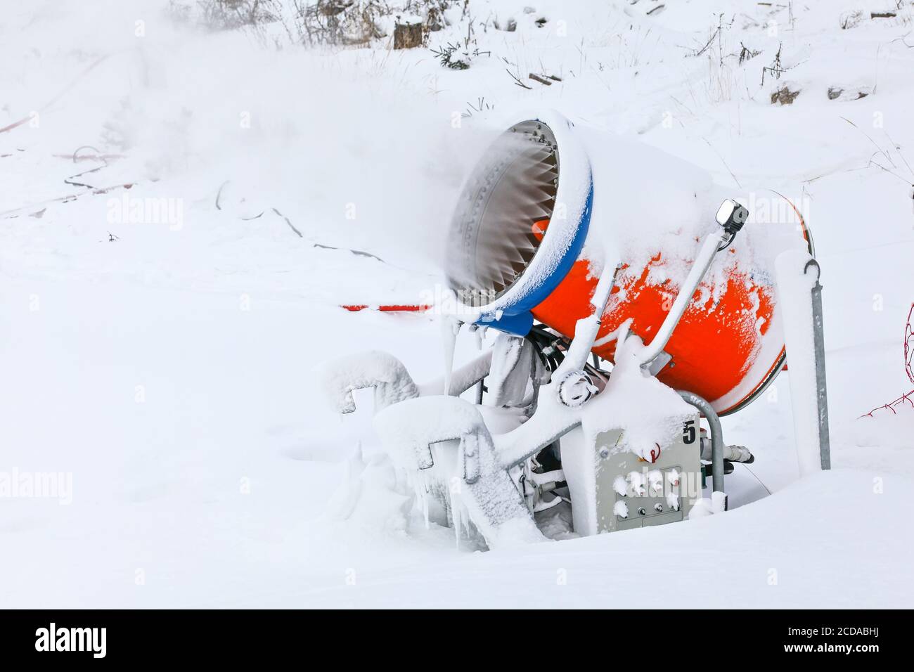 Snow cannon gun or machine sprays water and snowes a ski or cross-country  track 27596714 Stock Photo at Vecteezy