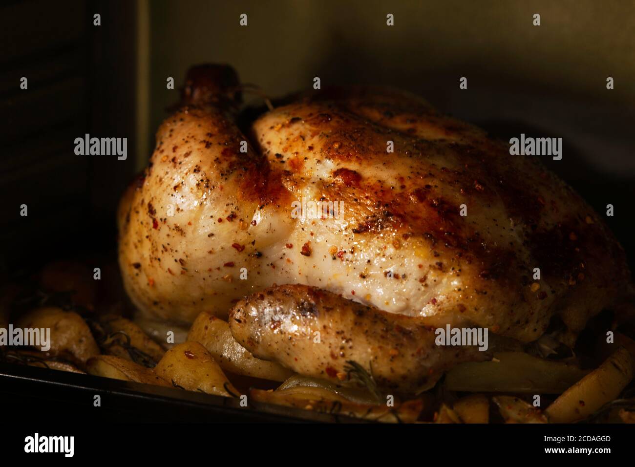 roasting whole chicken in oven Stock Photo Alamy