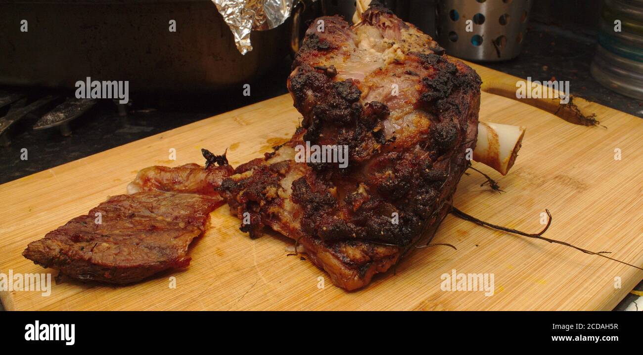 Roast lamb shoulder Stock Photo - Alamy