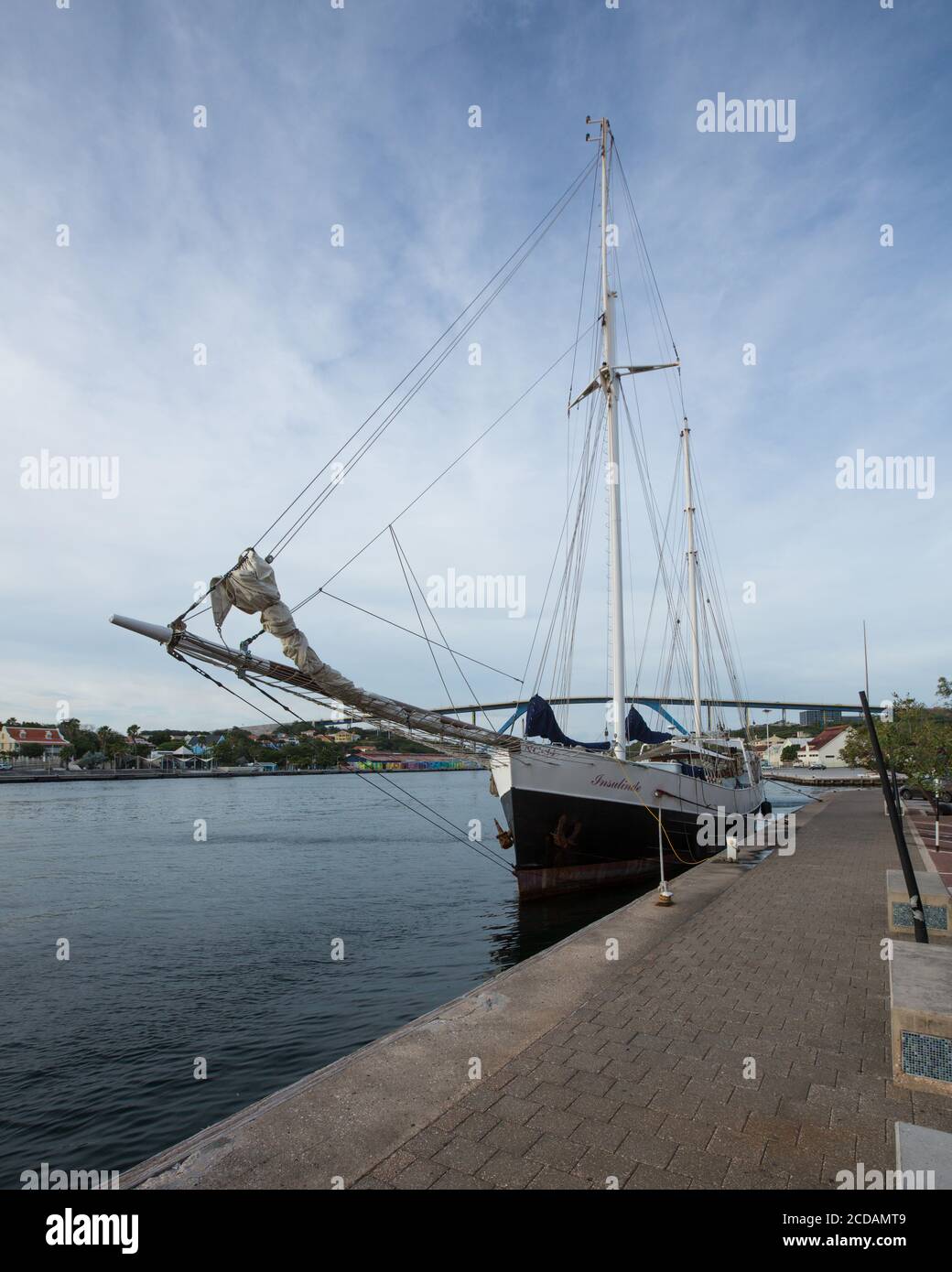 The 120-foot long Insulinde, a former sailing fishing ship built in Belgium in 1931, docked on the Punda waterfront in Willemstad, the capital of Cura Stock Photo