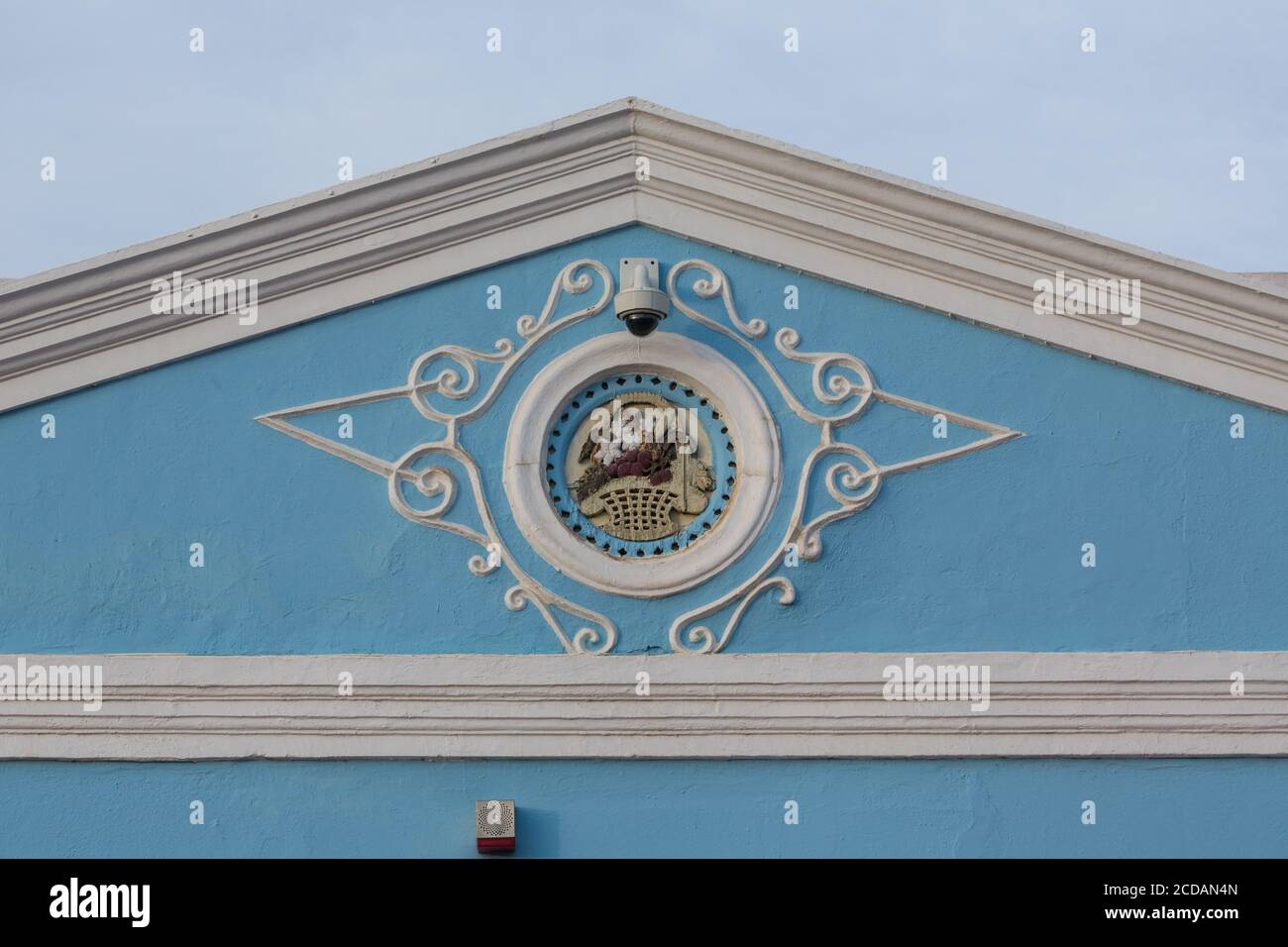 Detail on the gable of the historic home in the Scharloo neighborhood of the Punda district of Willemstad at Scharlooweg 35, built in 1888.  Now a ban Stock Photo