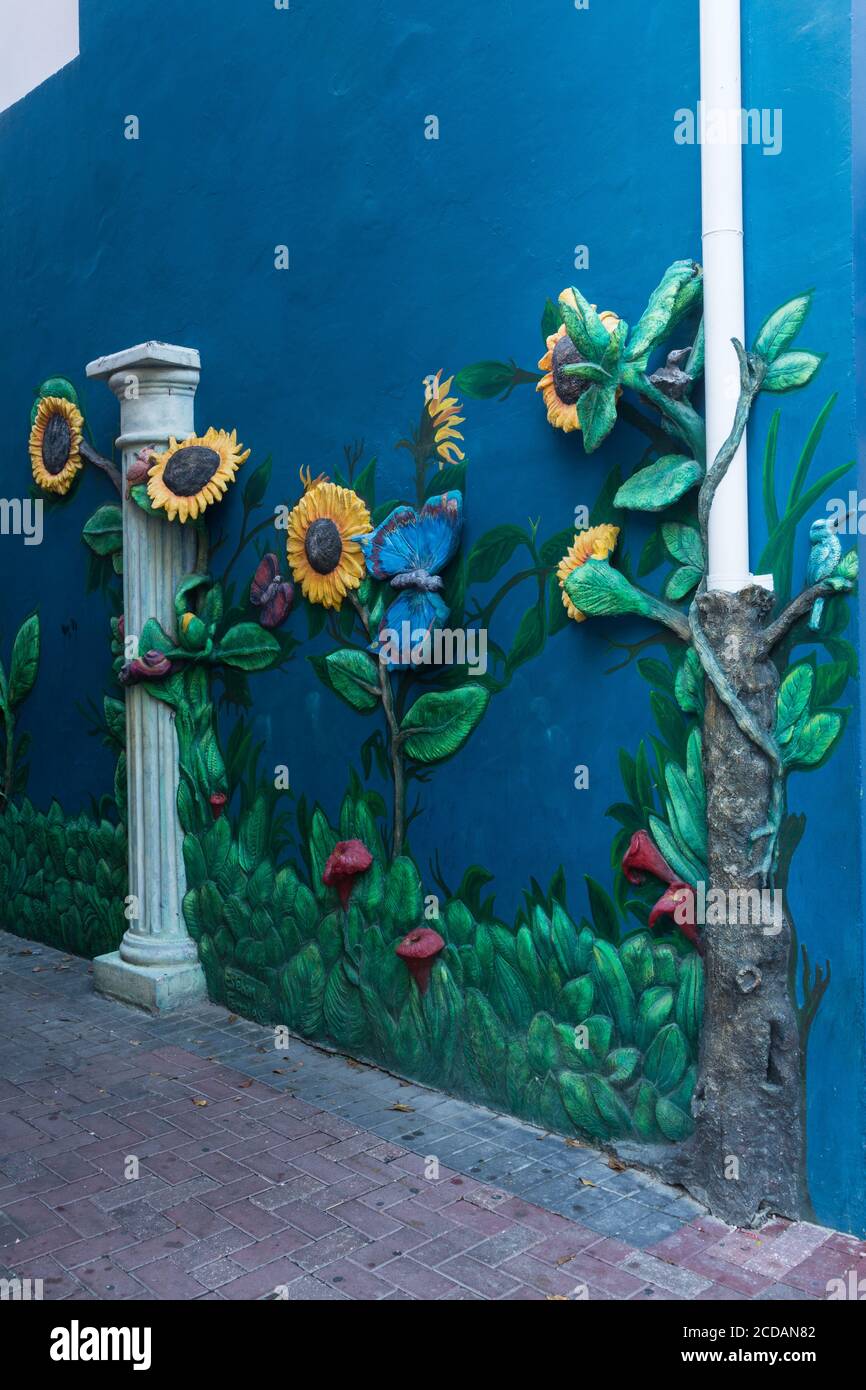 Whimsical art decorating a building in the Punda area of Willemstat, the capital city of the Caribbean island of Curacao.  The Historic Area of Willem Stock Photo