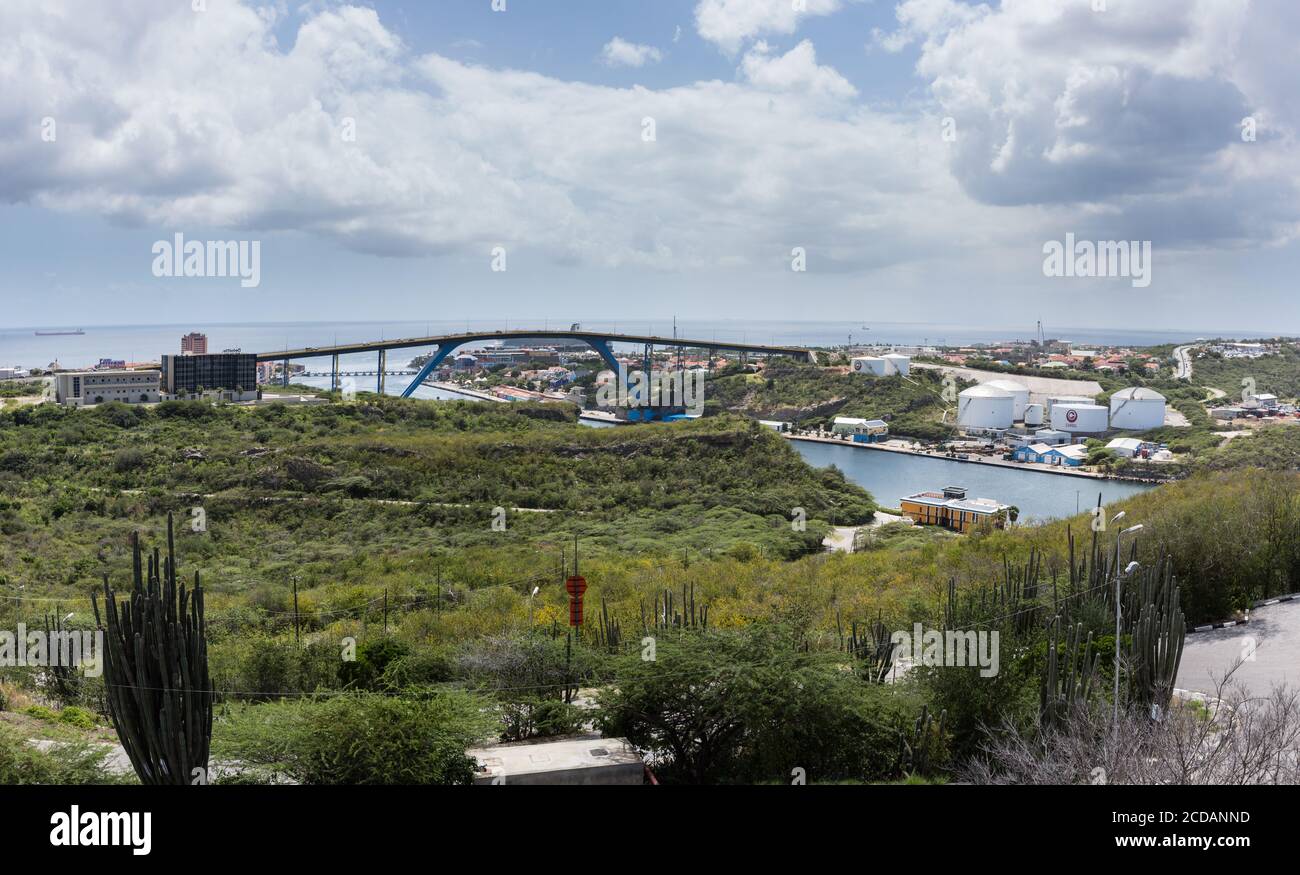 The Queen Juliana Bridge over St. Anna Bay in Willemstad, the capital of the Caribbean island nation of Curacao.  The bay connects the Schottegat lago Stock Photo