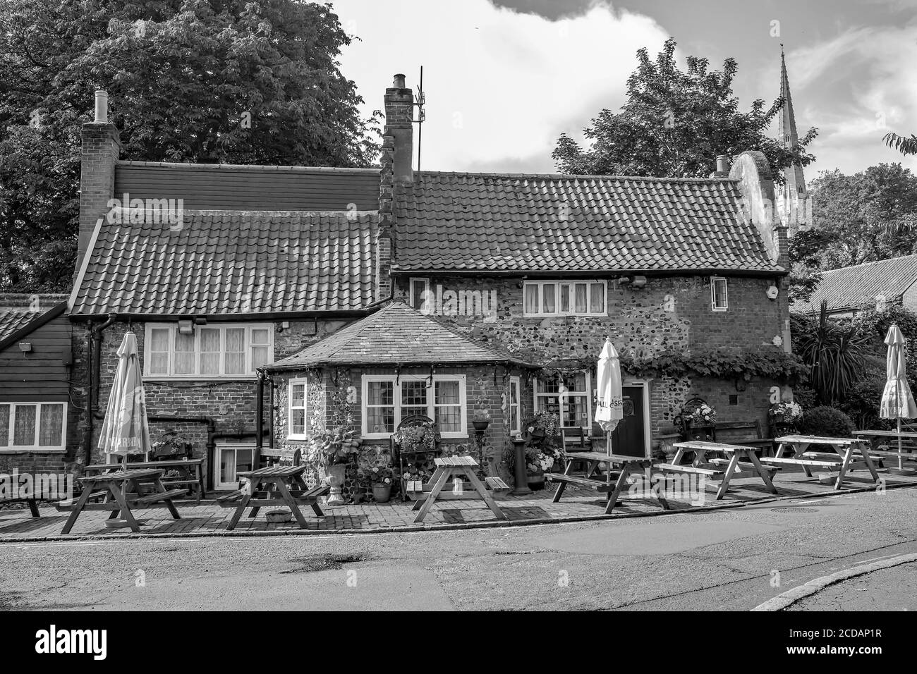A black and white photo of the exterior of the Adam & Eve pub