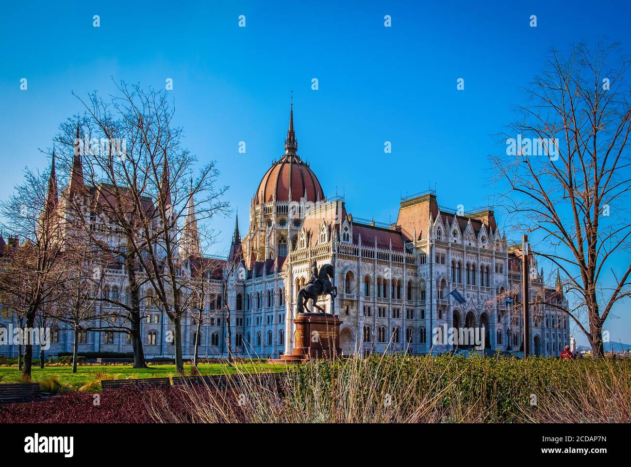 Budapest, Hungary, March 2020,  rear façade of the Hungarian Parliament Building from Kossuth Square and the Rakoczi Ferenc equestrian statue Stock Photo