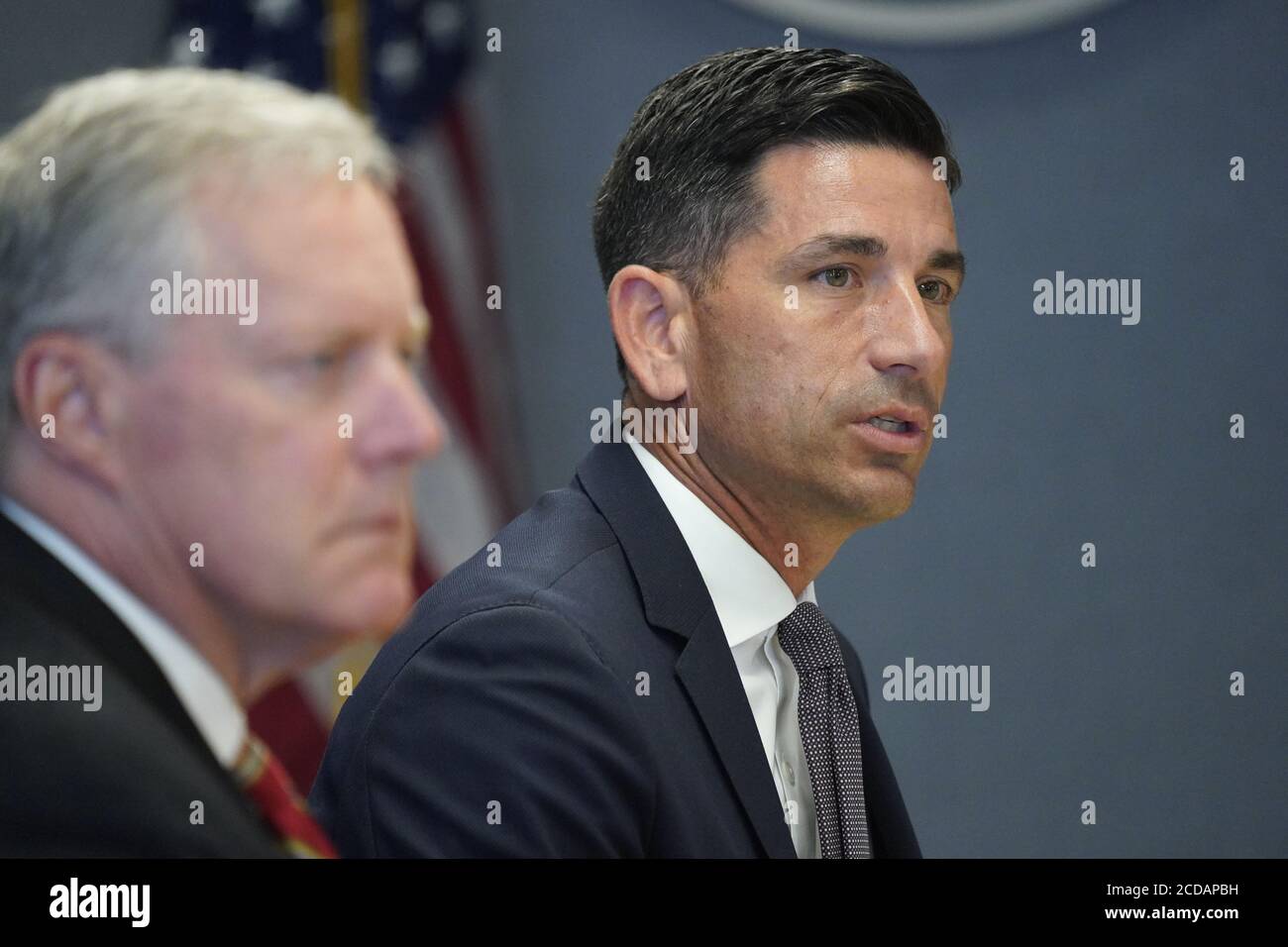 Chad Wolf, acting United States Secretary of Homeland Security, and Under Secretary of Homeland Security for Strategy, Policy, and Plans (R), makes his presentation during a briefing for US President Donald J. Trump and US Vice President Mike Pence during a visit to Federal Emergency Management Agency (FEMA) headquarters in Washington, DC for a briefing on Hurricane Laura on Thursday, August 27, 2020. At left is Mark Meadows, Assistant to the President and Chief of Staff.Credit: Erin Scott/Pool via CNP /MediaPunch Stock Photo