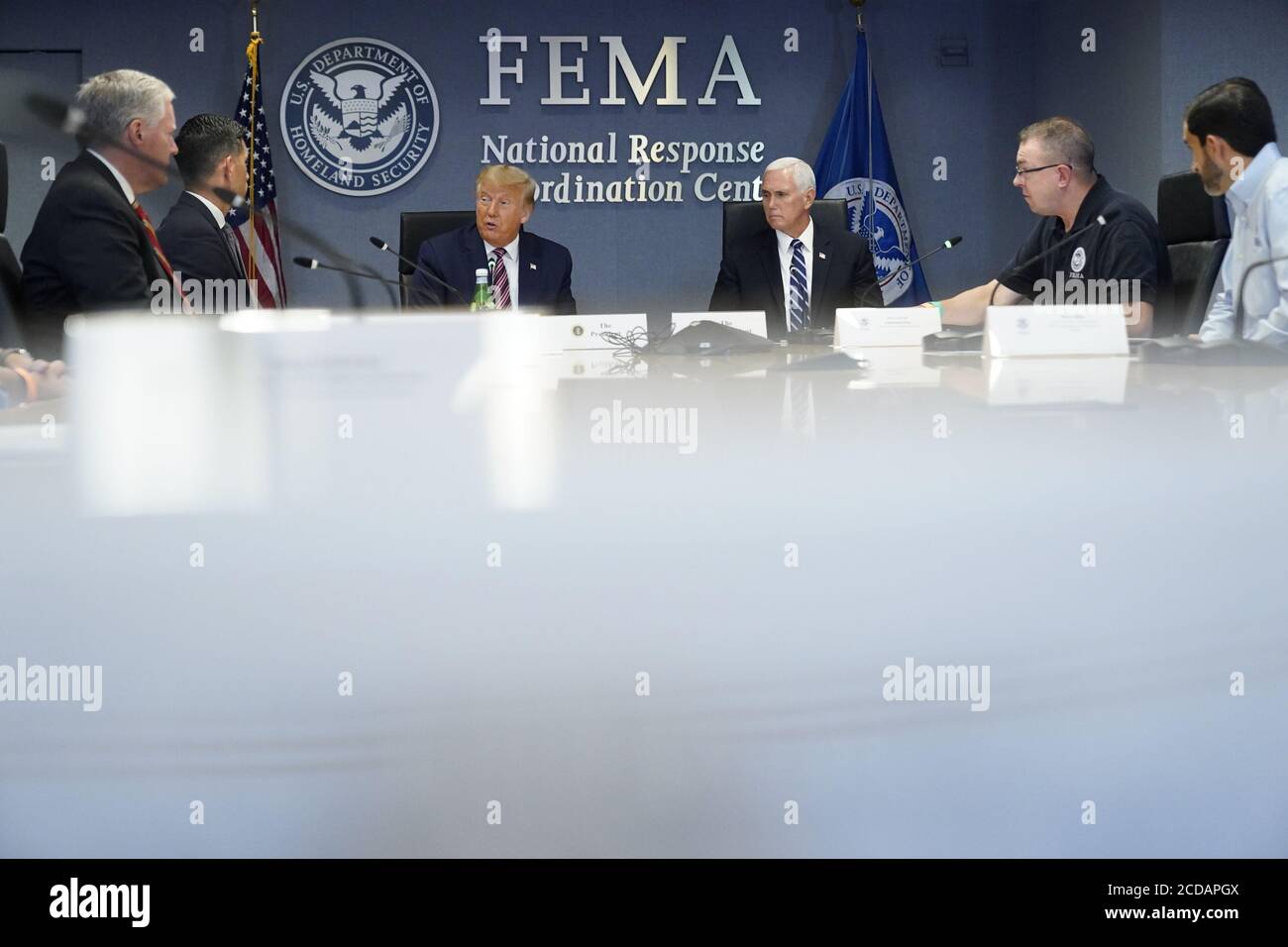 United States President Donald J. Trump and US Vice President Mike Pence visit the Federal Emergency Management Agency (FEMA) headquarters in Washington, DC for a briefing on Hurricane Laura on August 27, 2020. From left to right: Mark Meadows, Assistant to the President and Chief of Staff, acting US Secretary of Homeland Security Chad F. Wolf, US President Donald J. Trump, US Vice President Mike Pence, Pete Gaynor, Administrator, Federal Emergency Management Agency (FEMA).Credit: Erin Scott/Pool via CNP /MediaPunch Stock Photo