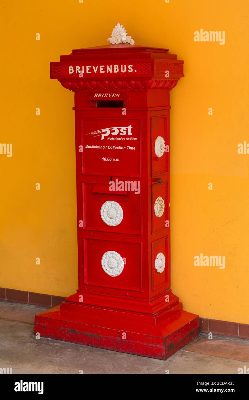 A red post box on the island of Curacao in the Netherlands Antilles in the Caribbean. Stock Photo