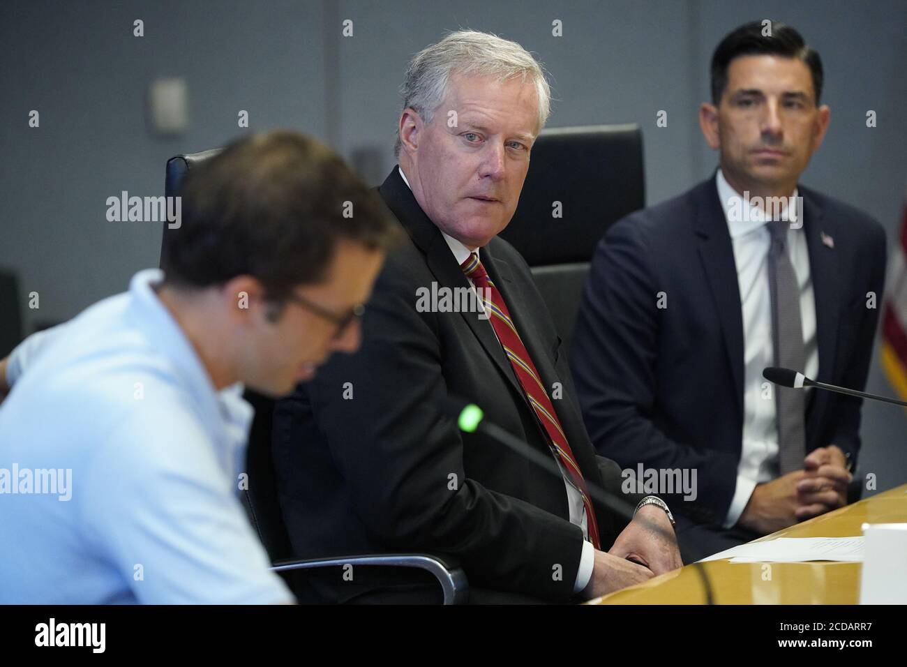 Acting United States Secretary of Homeland Security Chad F. Wolf, right, and Mark Meadows, Assistant to the President and Chief of Staff, center, listen as US President Donald J. Trump and US Vice President Mike Pence are briefed during a visit to the Federal Emergency Management Agency (FEMA) headquarters for a briefing on Hurricane Laura.Credit: Erin Scott/Pool via CNP *** Local Caption *** BSMID5075487 | usage worldwide Stock Photo